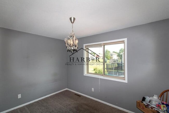 Building Photo - Updated 4 Bedroom Home with Remodeled Kitchen & Tiered Deck