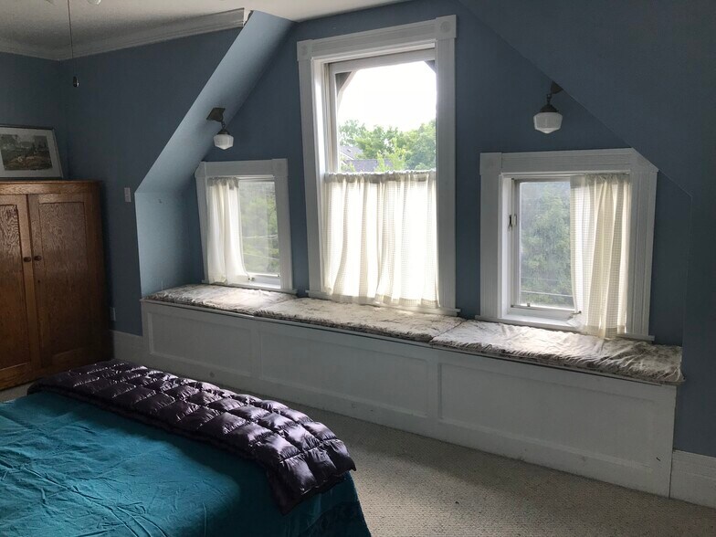 3rd floor front bedroom. Window seats open for storage. - 3284 Dawson Street