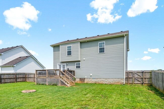Building Photo - Spacious 4-Bedroom Home with Modern Upgrad...