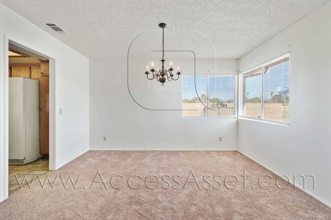 Building Photo - Single-Story 3 Bed with Covered Patio & Gated Yard