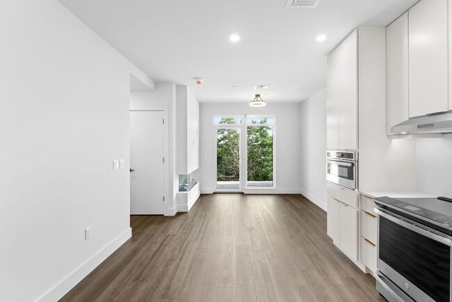 Building Photo - 2 Bedroom Corner-Unit with Wooded Balcony ...