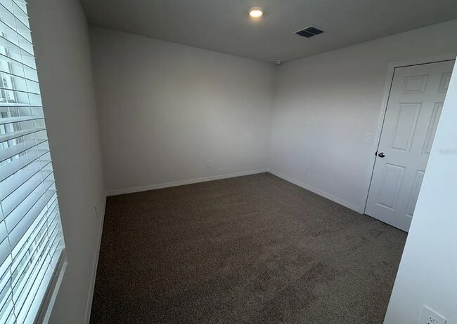 Building Photo - "Spacious 3-Bedroom Townhouse with Granite Elegance in St. Cloud – 4543 Rangeland Way"