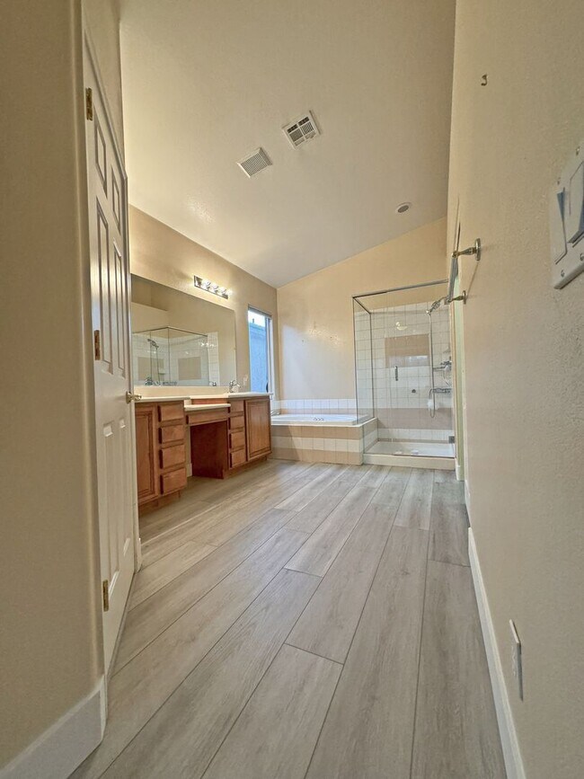 Building Photo - Vaulted Ceiling single-story home in a gat...