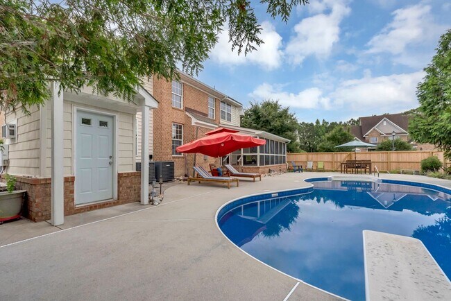 Building Photo - Beautiful brick home with a saltwater pool