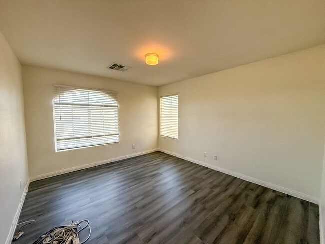 Building Photo - SPACIOUS HOME IN GATED COMMUNITY WITH POOL, RV PARKING & 4-CAR GARAGE!