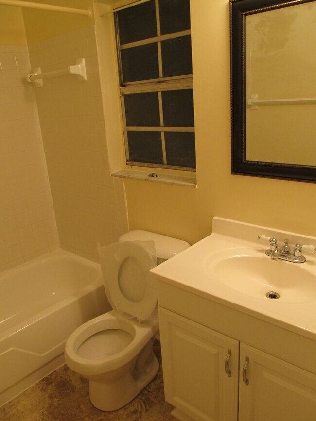 Building Photo - Three bedroom one and a half bathroom house with large yard space