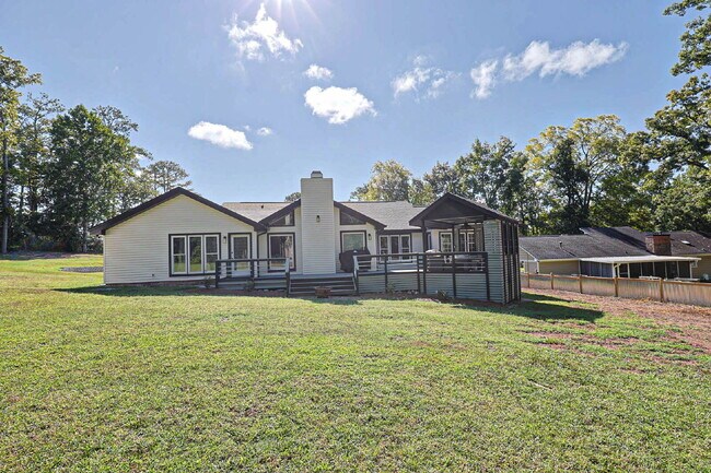 Building Photo - COMING SOON · Designer Renovation · Covered Deck Pavilion · 2-Car Garage · Lawn Care Included