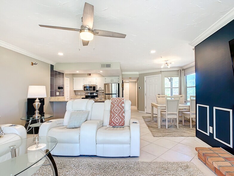 Living area - Electric recline leather couches - 2400 Feather Sound Dr Apt 421