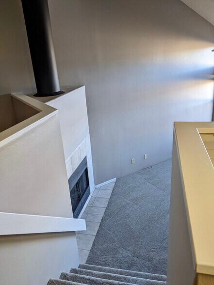 Fireplace/stairs to Living Room - 560 Autumn Crest Cir