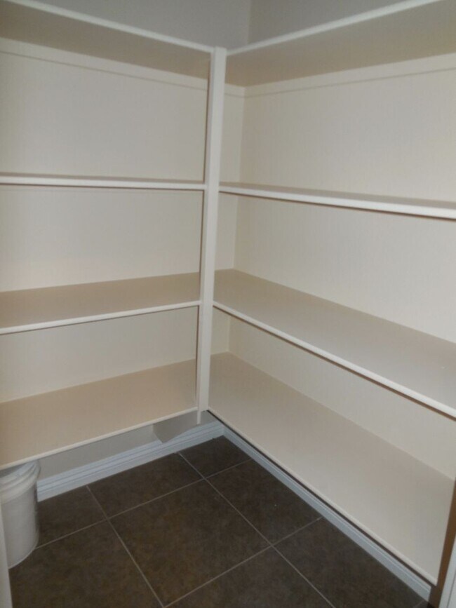 Building Photo - Spacious House w/Tons of Storage,Tile & Wo...