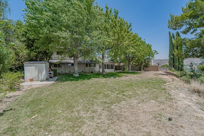 Building Photo - Spacious 4-Bedroom Home with Sun Room & Vi...