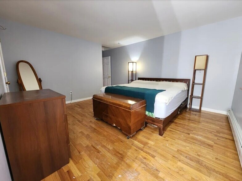 Master bedroom featuring walk in closet and master bath - 103 Prescott Ave