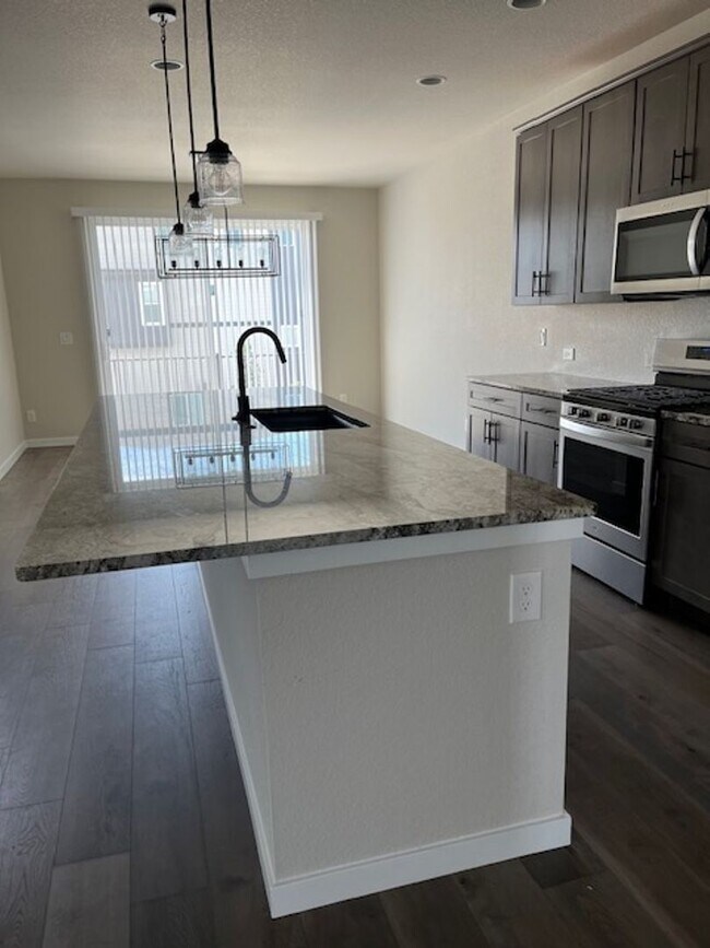 Building Photo - MODERN THREE STORY TOWNHOME WITH 2 CAR GAR...