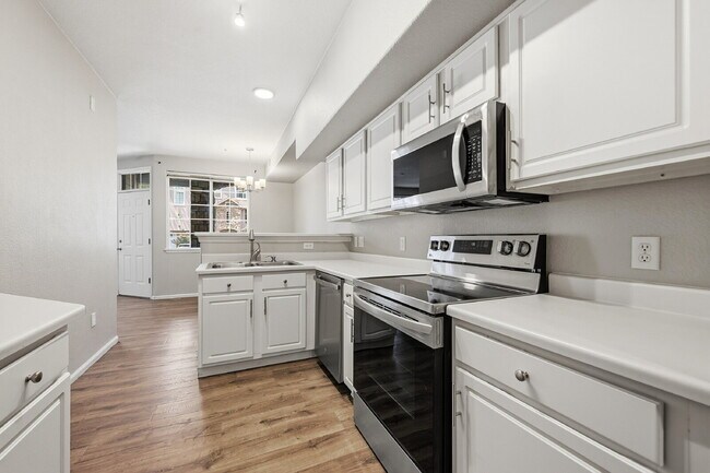 Building Photo - $1,745.95 - Ground-Level 1 Bed + Flex Room | 1.5 Bath Condo with Community Pool