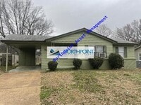 Building Photo - Three Bedroom With Fenced Back Yard