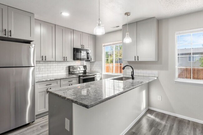 Building Photo - Clean, Bright 3 Bedroom with large yard an...