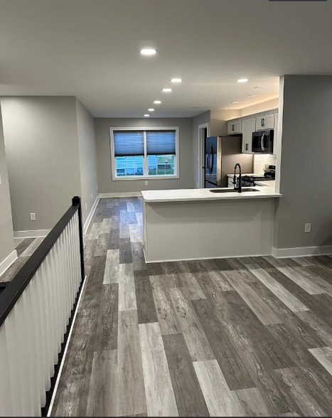 Living room looking into kitchen - 8195 Lake Pleasant Rd