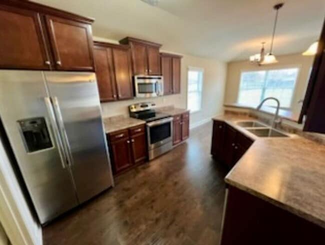 Building Photo - Settle In by the End of December—Apply Now!