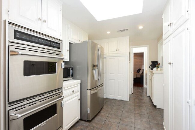 Building Photo - Welcome to this beautifully updated Spanis...