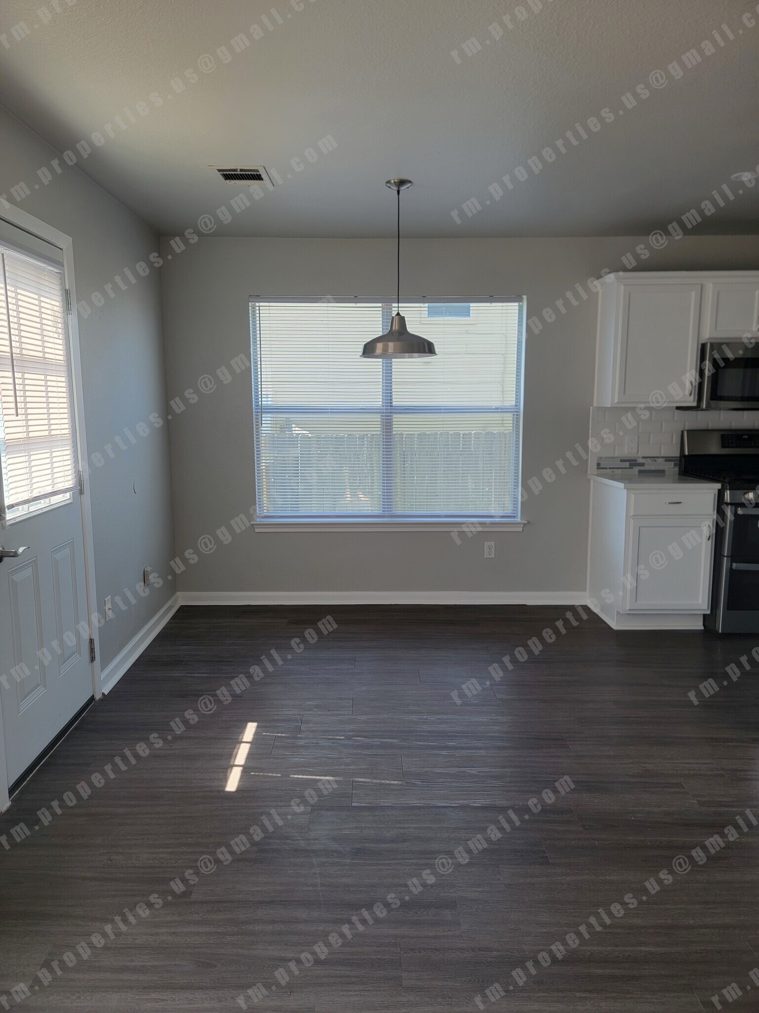 Dining room with brushed nickel lighting fixture - 2874 Southampton Way