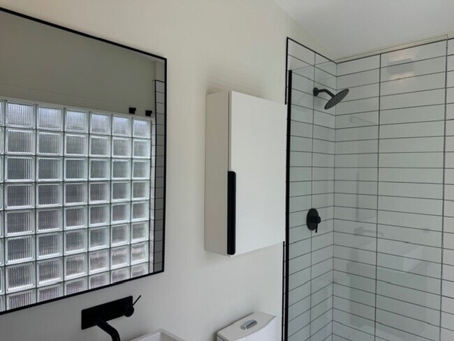 Building Photo - Vaulted Ceilings & Hardwood Floors in This Charming Indianapolis L