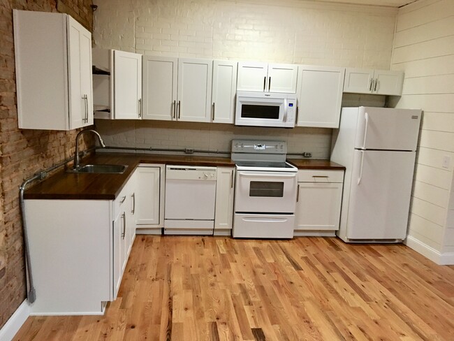 Updated kitchen, above range microwave, dishwasher, refrigerator, butcher block countertops - 100 1/2 S Pendleton St