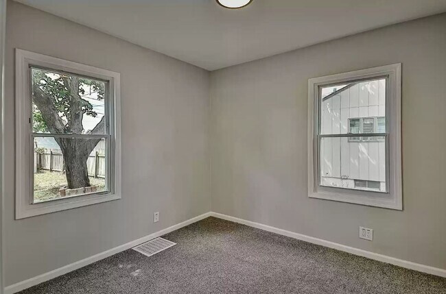 primary bedroom with new carpet - 743 Marie Ave