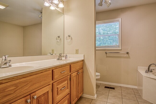 Building Photo - This beautiful home is located in a quiet private neighborhood and perfect for a serene living at...