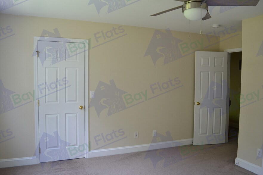 Bedroom at front of house with first of two closets. - 41195 Friendship Ct