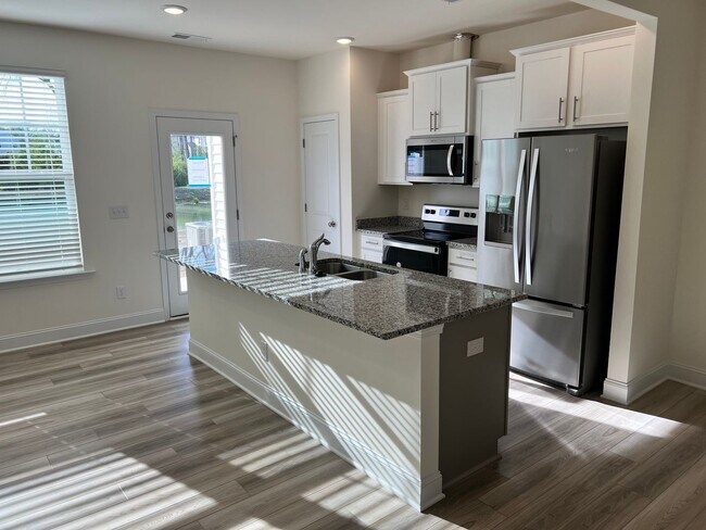 Building Photo - Like-New 3BR Townhome in Spring Village | Garage | Minutes to Downtown Angier