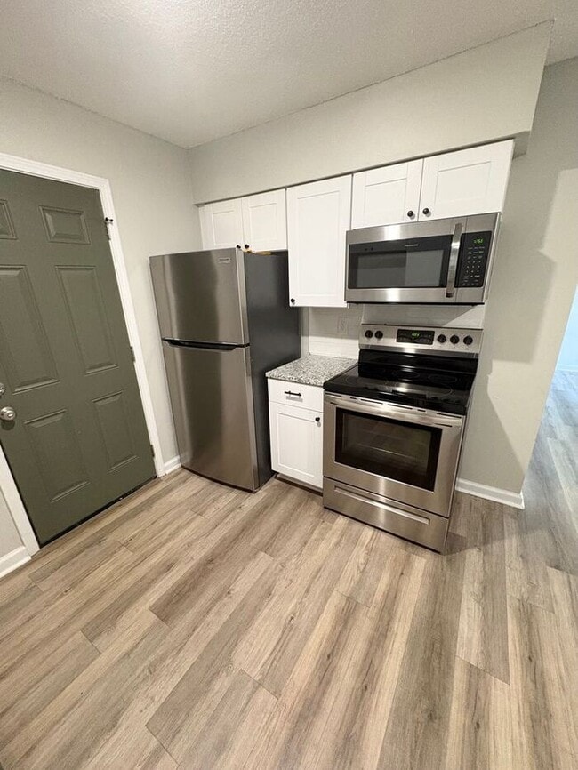 Building Photo - Steps from UofM & Highland Strip – First-Floor 2BR Apartment at The Den!