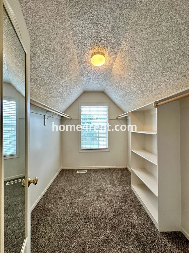 Building Photo - Beautiful Four-Bedroom Home with Three Car Garage, Wood Floors, Finished Basement and a Fenced Ya...