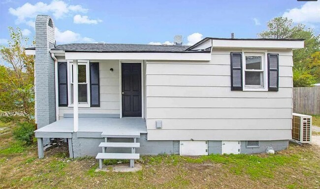 Fenced backyard with covered outdoor area—great for relaxing or outdoor use. - 520 Commonwealth St
