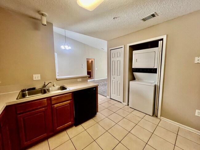 Building Photo - Gated Comfort Condo, Poolside Vibes: Your Next Home Awaits at Merrill Pines