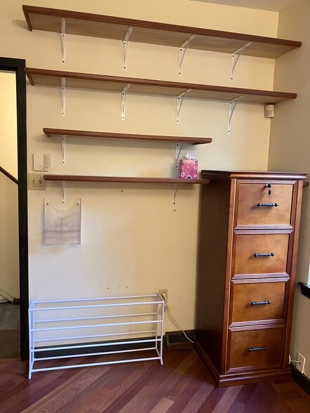 built in shelves and file cabinet inside unit, just to left of entry - 6344 Aurelia St