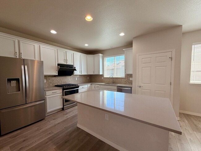 Building Photo - Move-In Ready 3-Story Townhome with Loft & 2-Car Garage