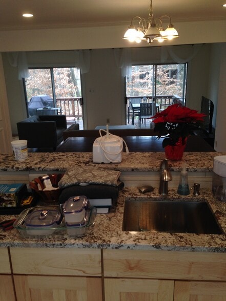 Kitchen sink looks out onto deck and woods - 10651 Pine Haven Ter