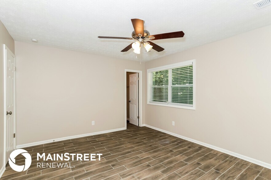 Building Photo - 9073 Woodgreen Way