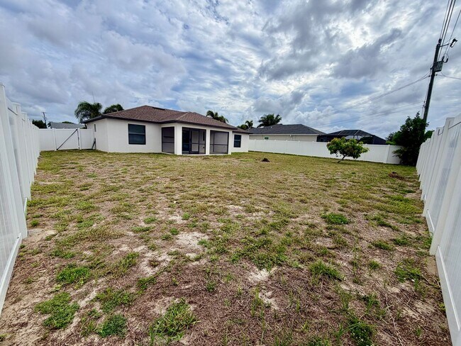 Building Photo - Move-In Ready 3BR Home in SW Cape Coral with Fenced Yar+Screened Lanai+Lawn Care Included+Pet Fri...