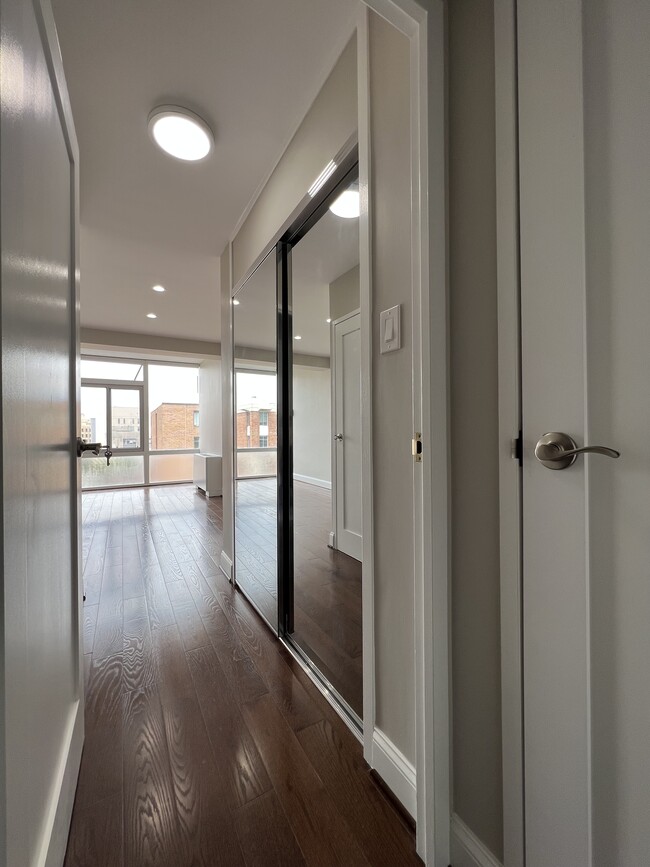 Bedroom with a walk-in and a mirrored reach-in closet - 730 24th St NW