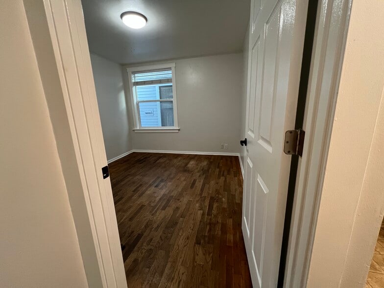 View of bedroom from hallway. - 620 6th Ave