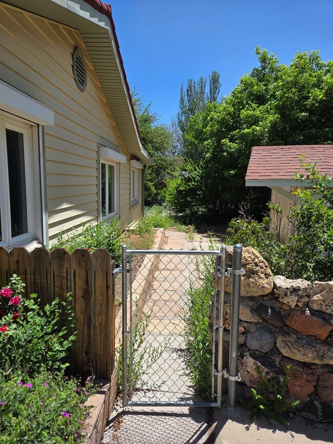 Building Photo - COMING IN JULY! Spacious 4-Bedroom Home in...