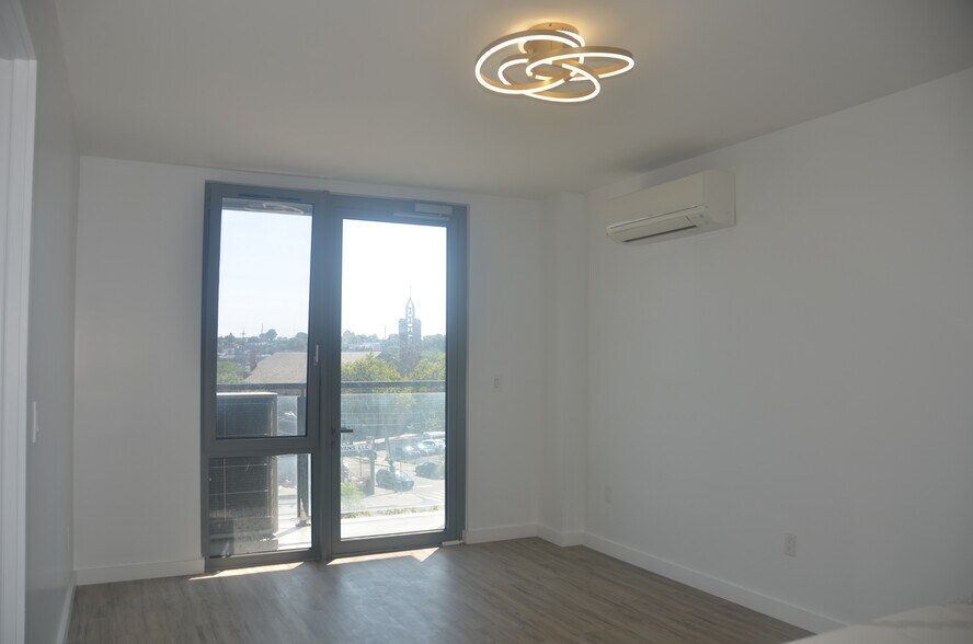 Living room with light - 7065 Queens Blvd