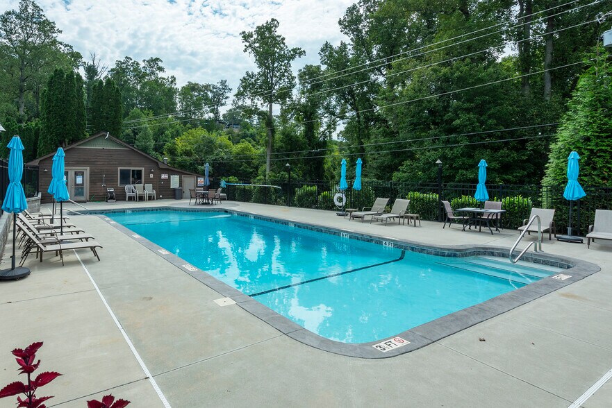 Private community pool and clubhouse enclosed by lush, mature timber. - 405 Windswept Dr