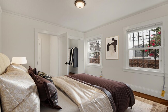 Main bedroom with two large windows and walk in closet. This master has two entrance and exists. - 2108 E 23rd St