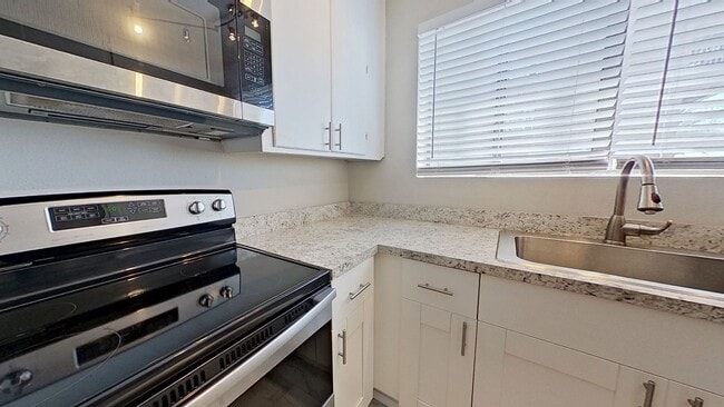 Building Photo - Riverfront Living! First Floor Unit w/ Private Patio, Stunning Views & Upgraded Kitchen