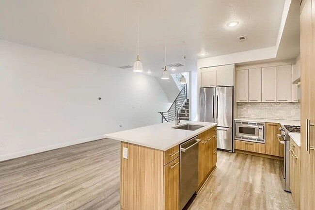 Building Photo - Modern LoHi Living with Rooftop Deck & City Views!!