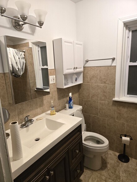 New tile and wall cabinets - 7259 S Constance Ave
