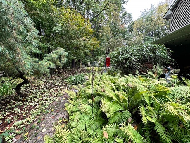 Building Photo - Dream Home in Highland, Michigan: Your Private Oasis on 5 Wooded Acres