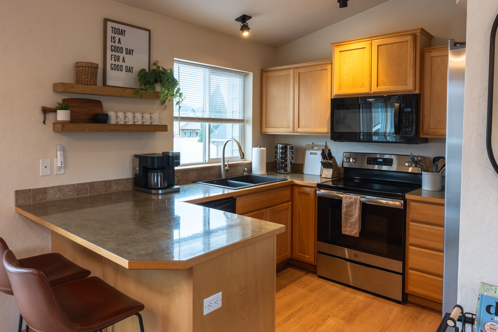 Kitchen - Clean and Cozy - New Delta Faucet and Whirlpool microwave - 2805 W Dumont Dr